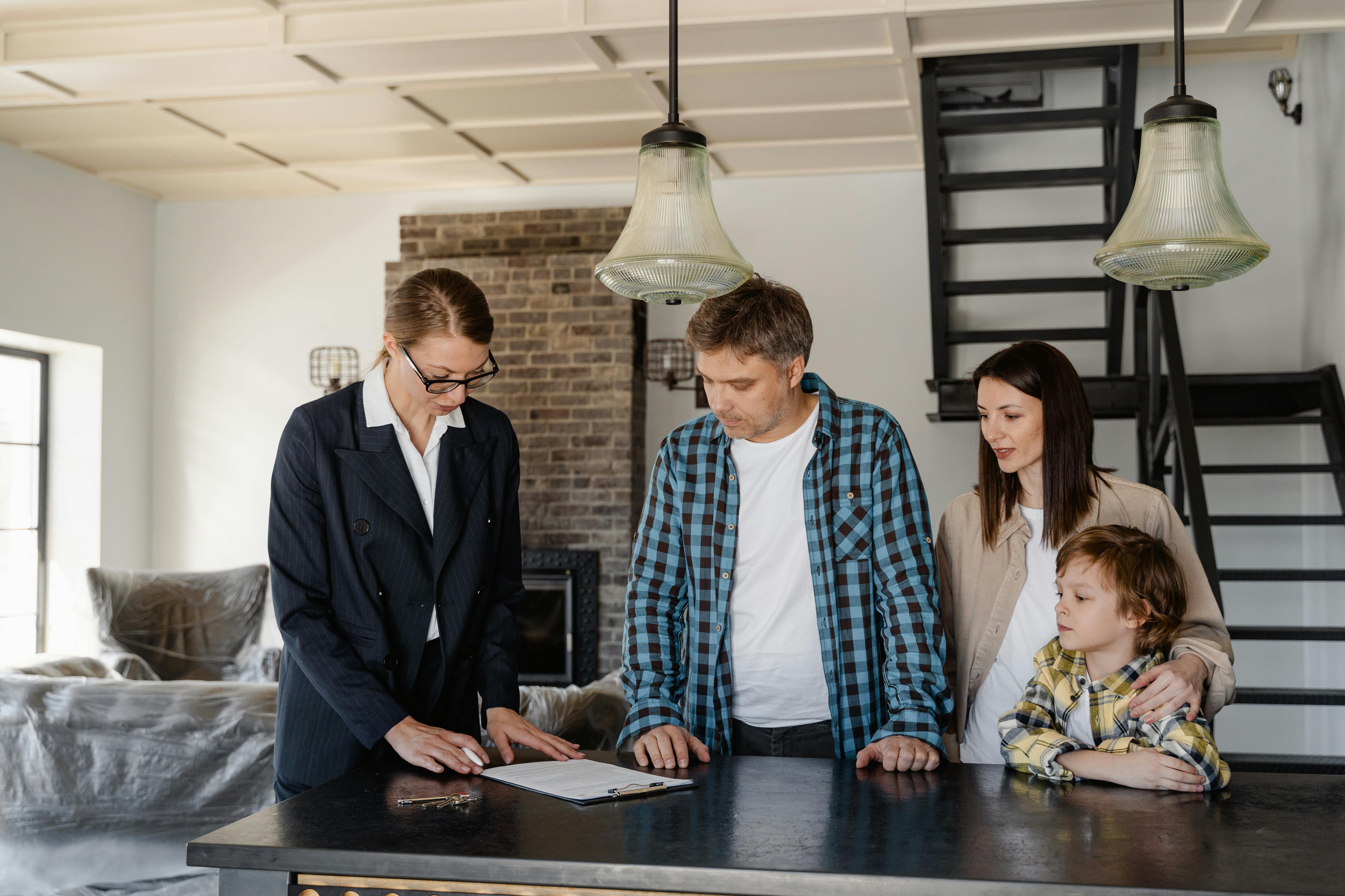A family viewing a UK home with their agent
